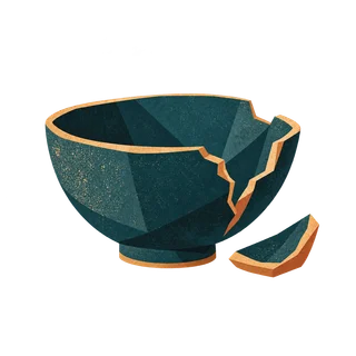 A cracked bowl with a broken piece beside it.