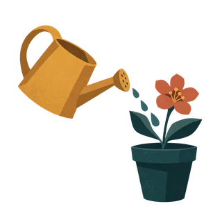 A watering can watering a small flowering plant.